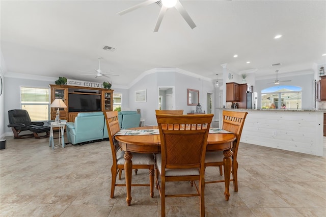 dining room featuring ceiling fan, plenty of natural light, and crown molding