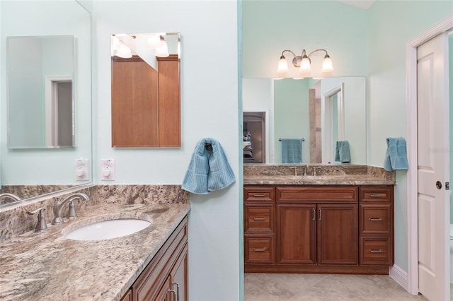 bathroom with tile patterned floors and vanity