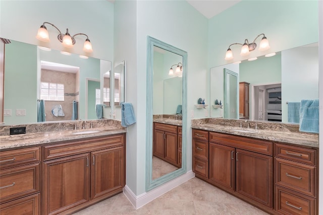 bathroom featuring tile patterned flooring and vanity