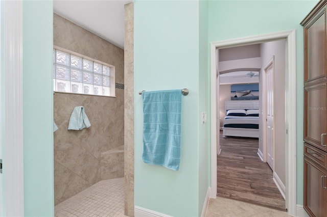 bathroom featuring tiled shower