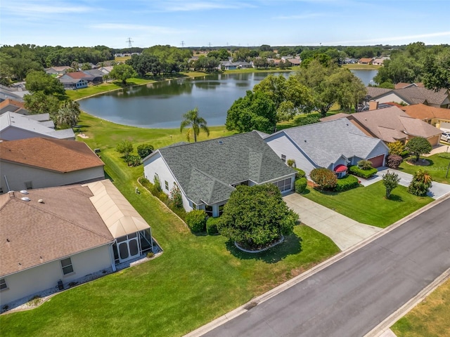 birds eye view of property with a water view