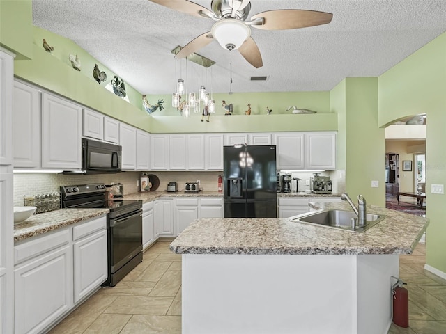 kitchen with white cabinets, black appliances, sink, ceiling fan, and a textured ceiling