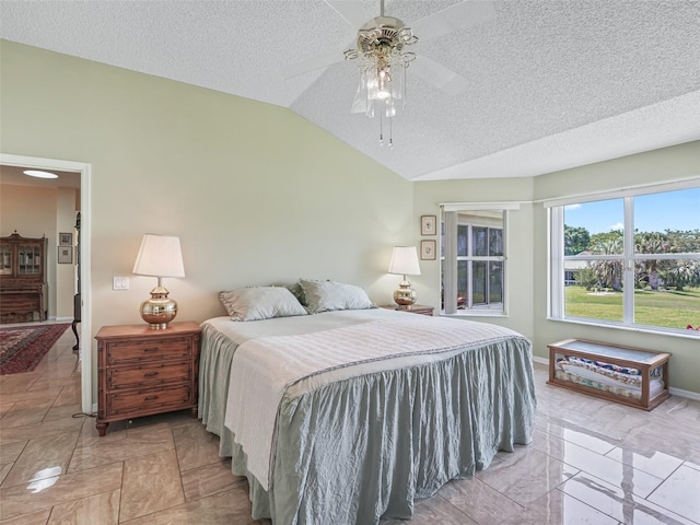 tiled bedroom with lofted ceiling, ceiling fan, and a textured ceiling