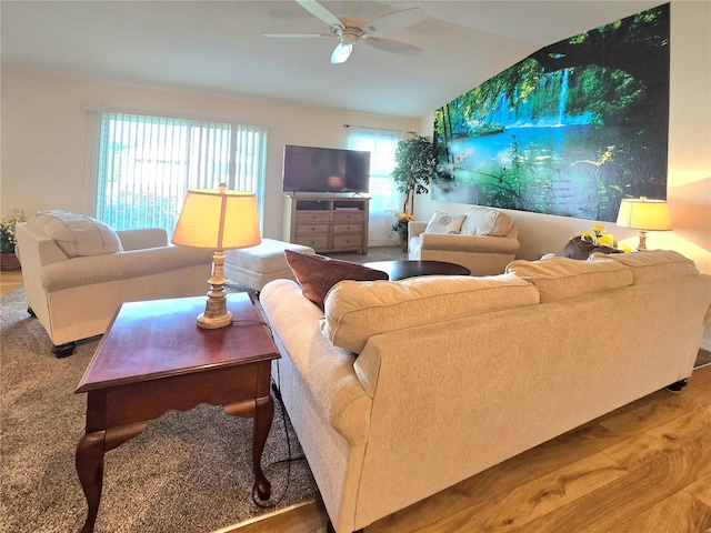 living room featuring hardwood / wood-style floors and ceiling fan