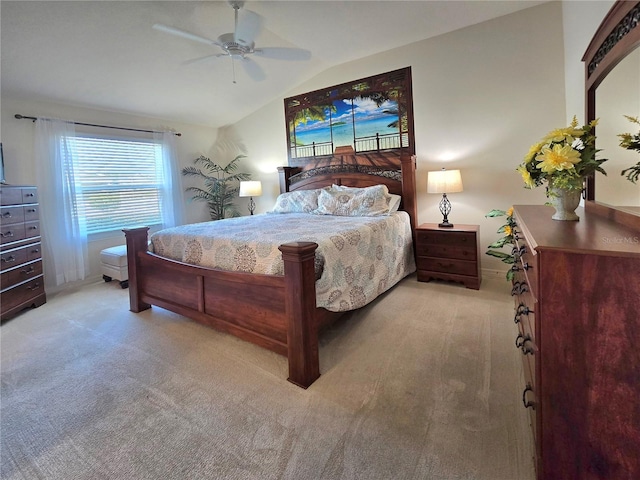 bedroom featuring lofted ceiling, carpet floors, and ceiling fan