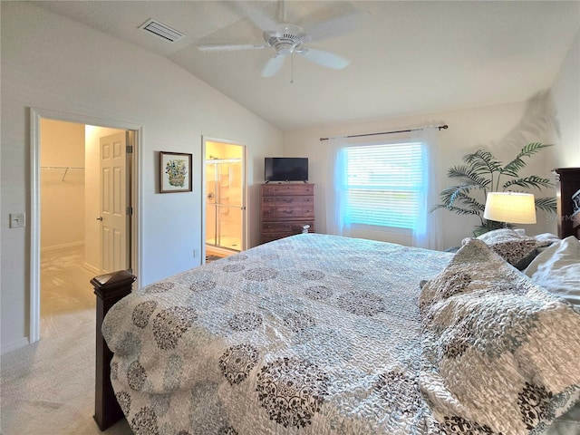 bedroom with a closet, ceiling fan, lofted ceiling, carpet flooring, and a spacious closet