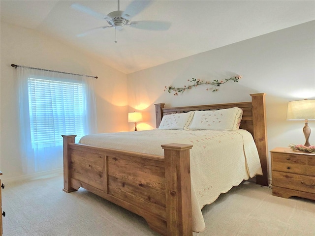 carpeted bedroom with lofted ceiling and ceiling fan