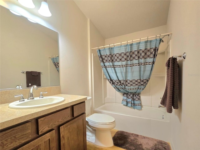 full bathroom with vanity, toilet, and shower / tub combo with curtain