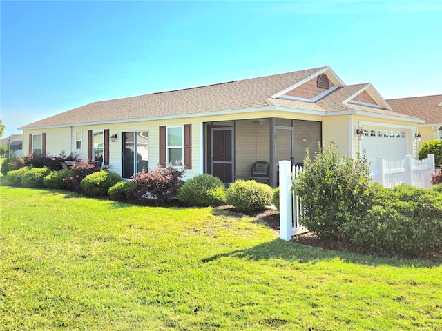 ranch-style home with a sunroom and a front yard