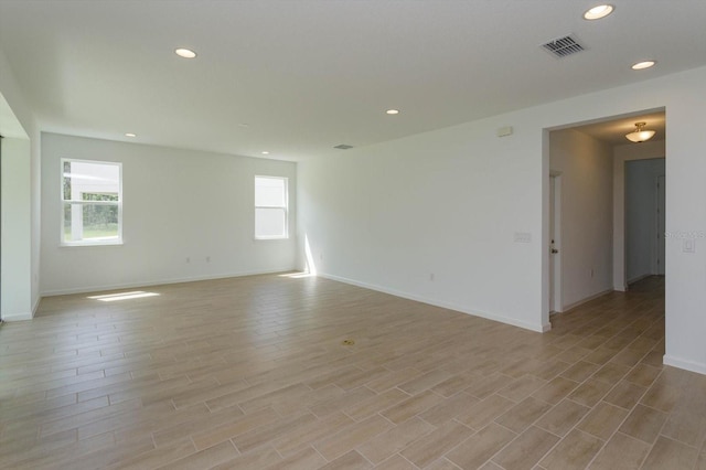 spare room with light wood-type flooring