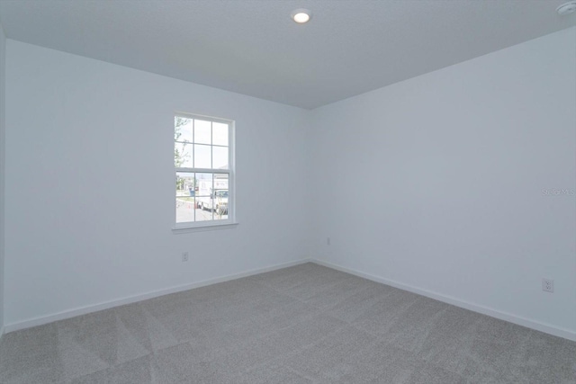 unfurnished room with carpet floors