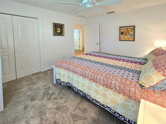 carpeted bedroom with a closet and ceiling fan