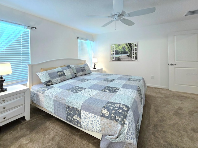 carpeted bedroom with ceiling fan