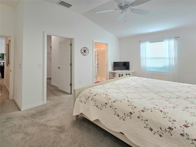 carpeted bedroom featuring ensuite bath, vaulted ceiling, and ceiling fan