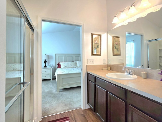 bathroom featuring vanity and hardwood / wood-style floors