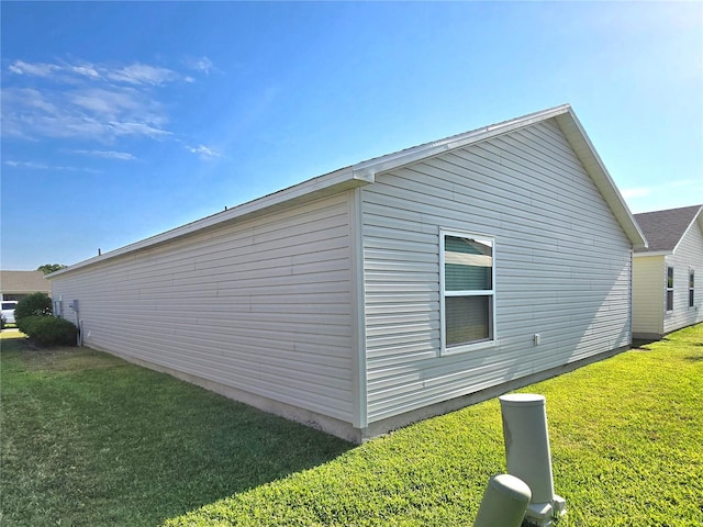 view of property exterior featuring a lawn