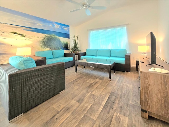 living room with wood-type flooring, ceiling fan, and lofted ceiling