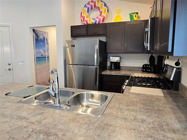 kitchen featuring dark brown cabinets, sink, and appliances with stainless steel finishes