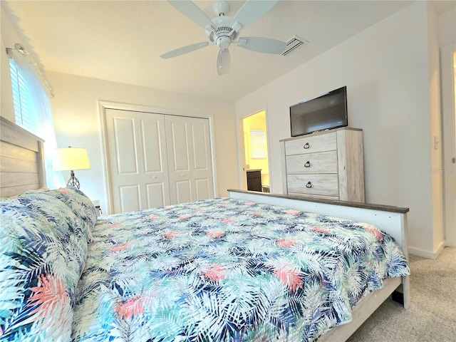 bedroom with a closet, ceiling fan, and carpet floors