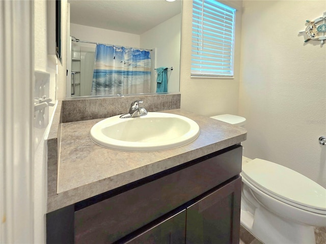 bathroom with oversized vanity and toilet