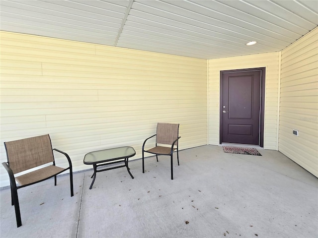 entrance to property with a patio area