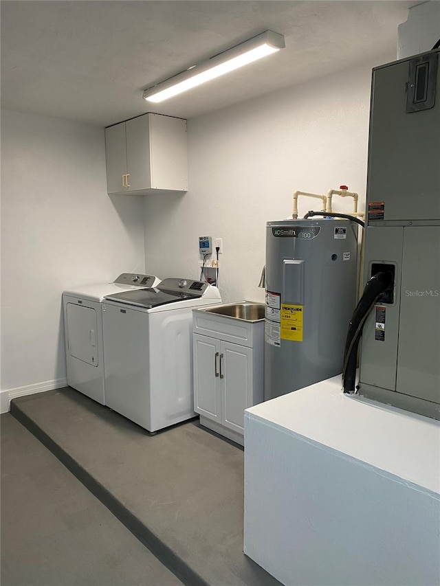 laundry room featuring sink, cabinets, water heater, heating unit, and washer and dryer