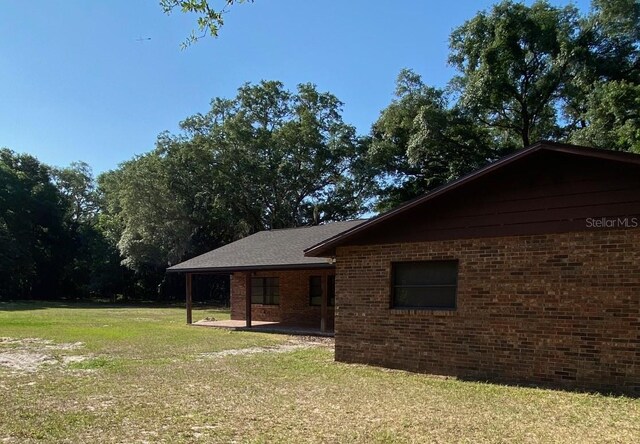 exterior space featuring a yard and a patio