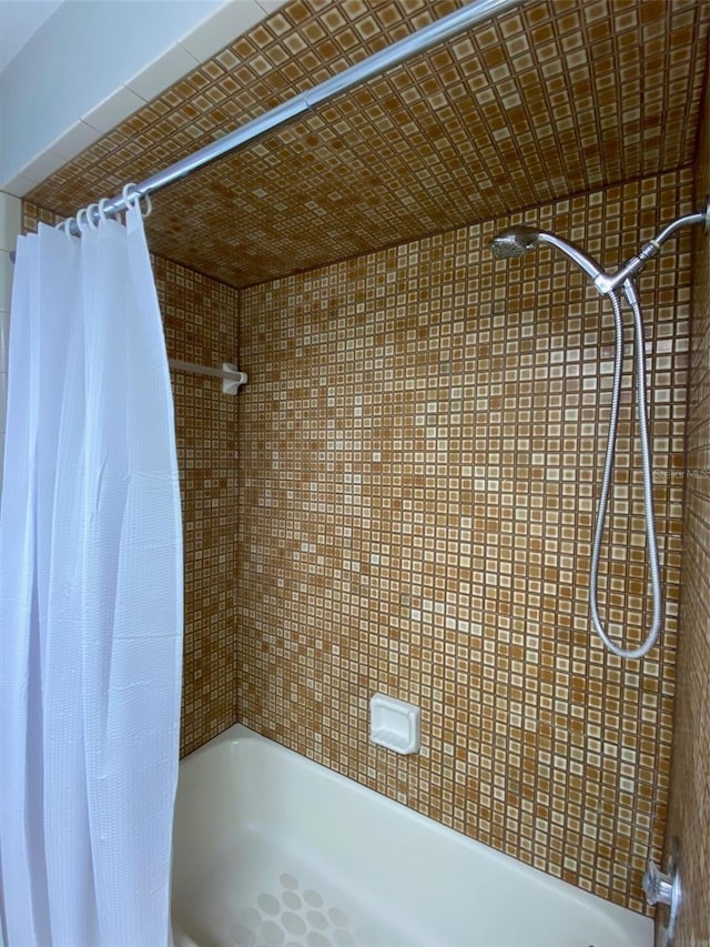 bathroom with a shower with curtain