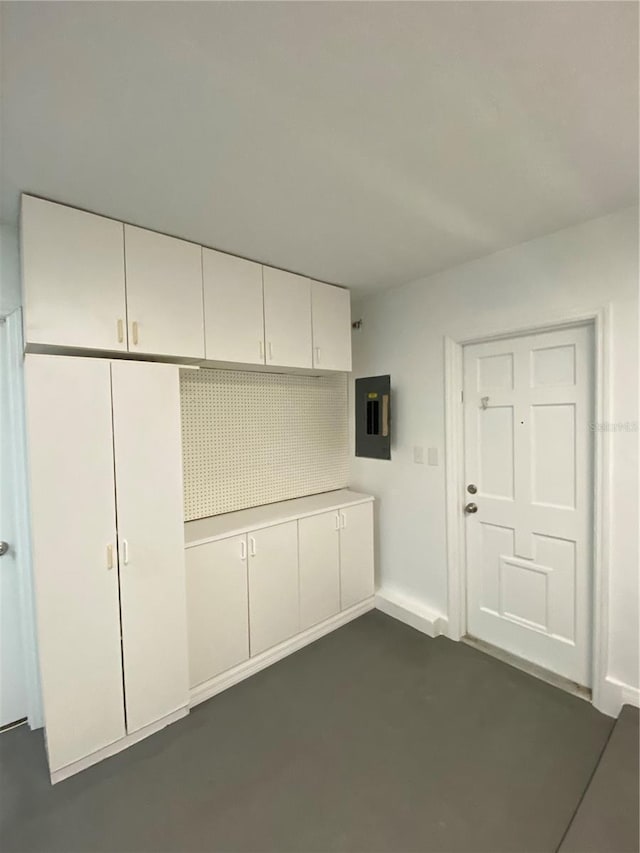 1921 Smitty Rd, Weirsdale, FL 32195 - interior space with electric panel and baseboards
