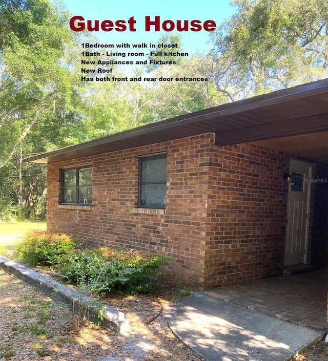 1921 Smitty Rd, Weirsdale, FL 32195 - view of home's exterior featuring brick siding
