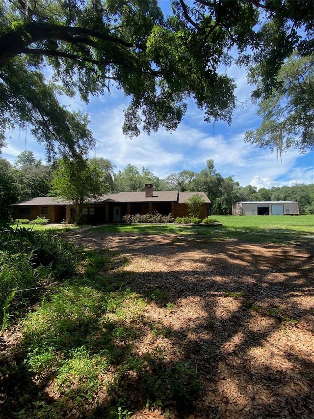 1921 Smitty Rd, Weirsdale, FL 32195 - view of yard featuring an outdoor structure