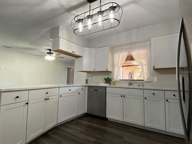 1921 Smitty Rd, Weirsdale, FL 32195 - kitchen with stainless steel appliances, light countertops, white cabinets, dark wood-style flooring, and a peninsula