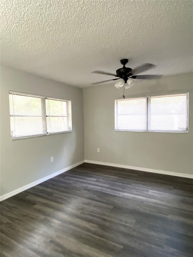 1921 Smitty Rd, Weirsdale, FL 32195 - empty room featuring a textured ceiling, ceiling fan, and dark wood-type flooring
