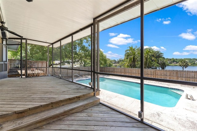 view of pool featuring a deck with water view