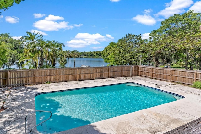 view of pool featuring a water view