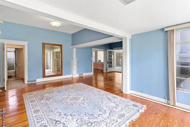 empty room with hardwood / wood-style floors