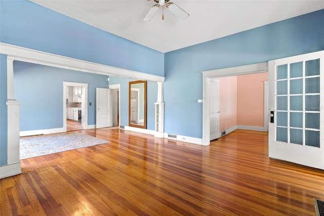 unfurnished room featuring hardwood / wood-style floors and ceiling fan