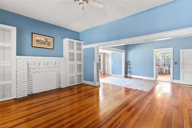 unfurnished room with ceiling fan and wood-type flooring