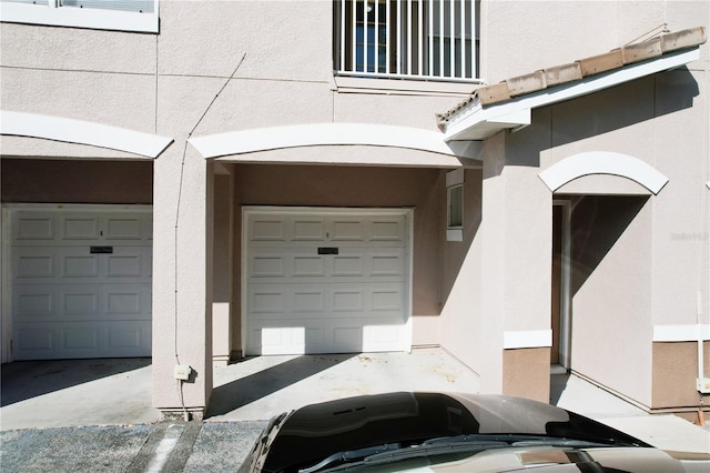 view of exterior entry featuring a garage