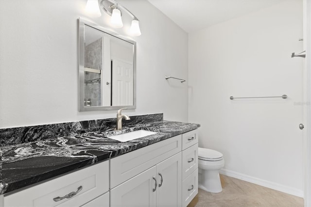 bathroom with tile patterned floors, a shower with door, vanity, and toilet