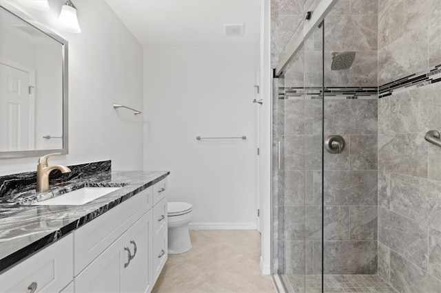 bathroom featuring walk in shower, vanity, and toilet