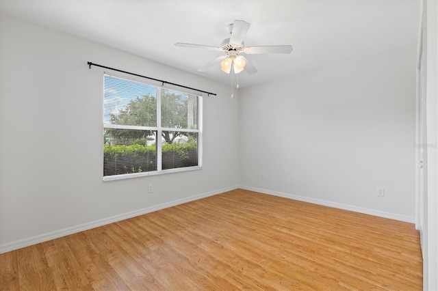 empty room featuring ceiling fan and light wood-type flooring