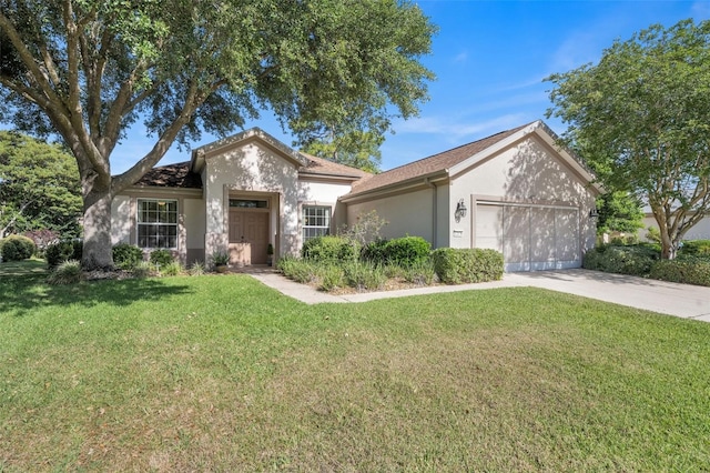 view of front facade featuring a garage and a front yard