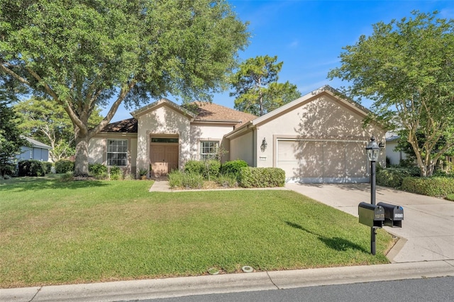 ranch-style house featuring a garage and a front lawn