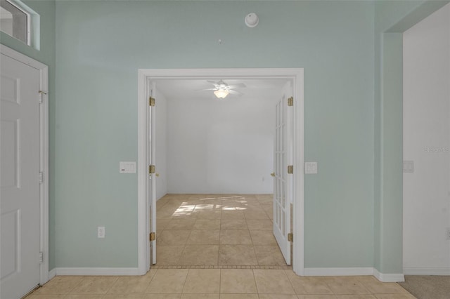 hallway featuring light tile floors