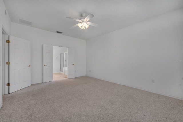 unfurnished bedroom featuring light carpet and ceiling fan