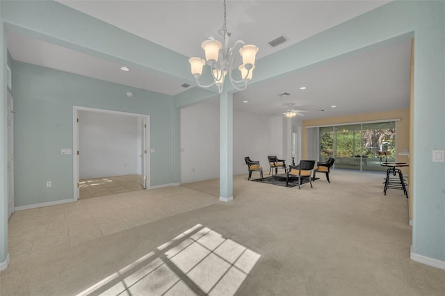 interior space with ceiling fan with notable chandelier