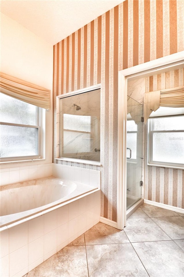 bathroom with tile patterned floors and a shower with shower door