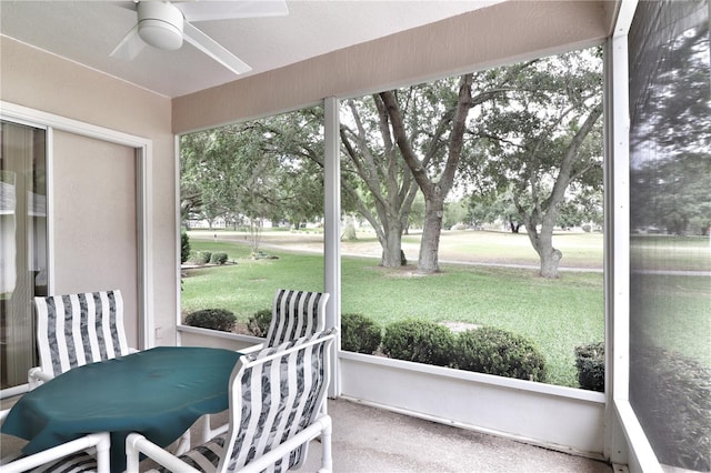 sunroom featuring plenty of natural light and ceiling fan