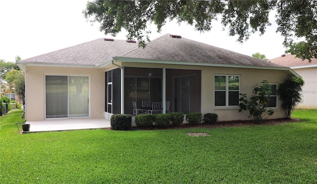 back of house featuring a sunroom and a yard